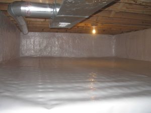 Crawl space encapsulation with a white vapor barrier covering the floor and foundation walls beneath exposed HVAC ductwork.